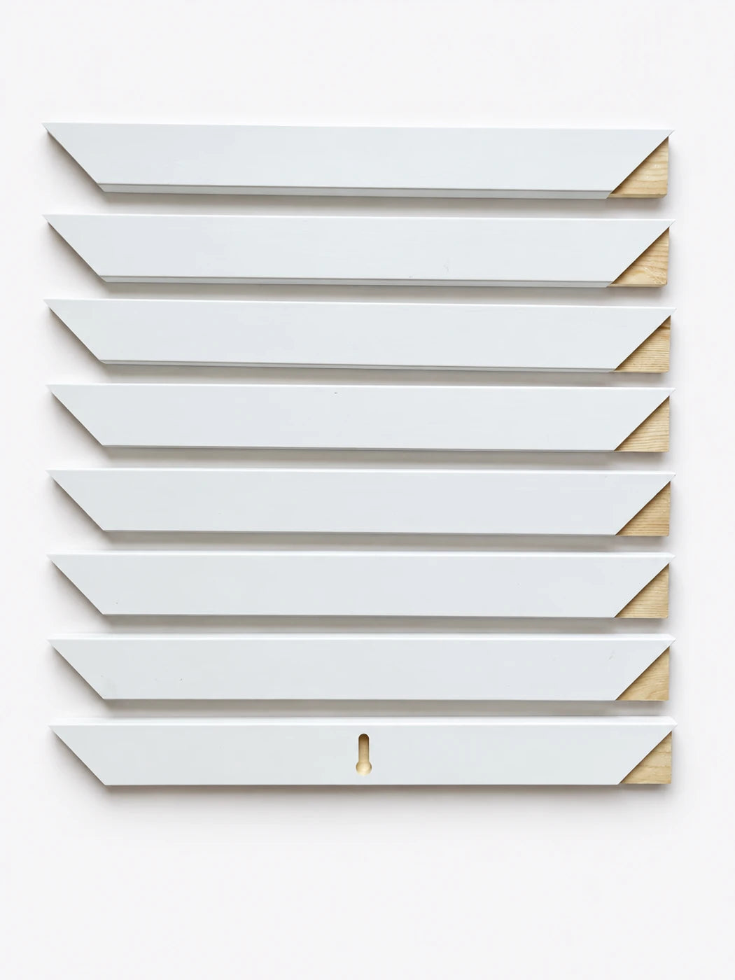 The eight wood sections supplied for one InstaFrame, arranged as front and back parts