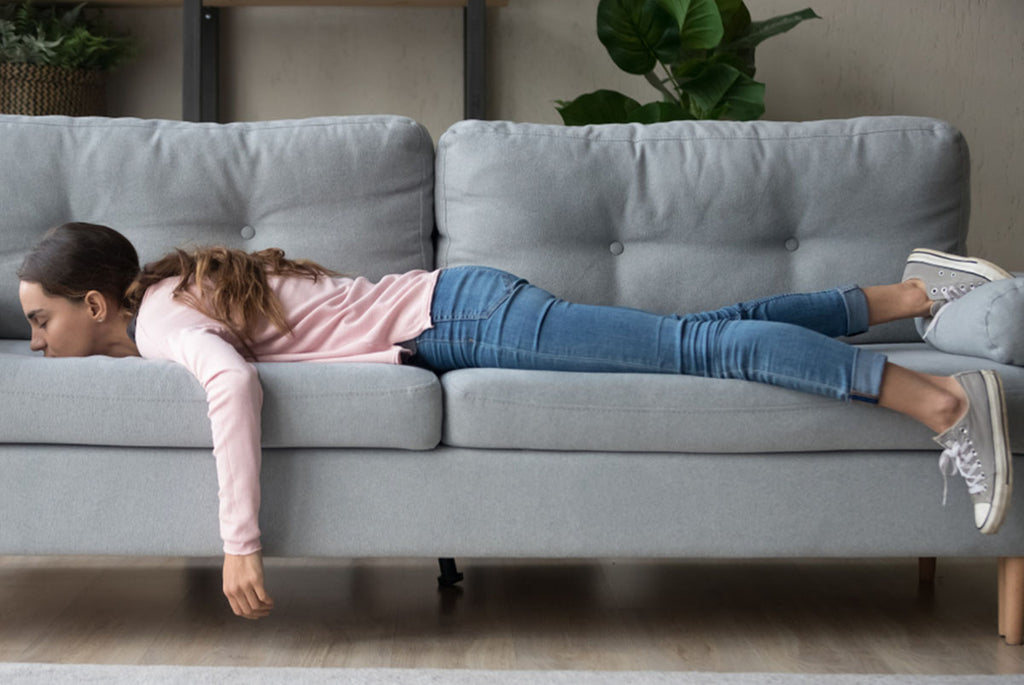 bored woman napping on couch
