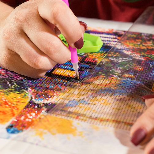 closeup working on diamond art painting