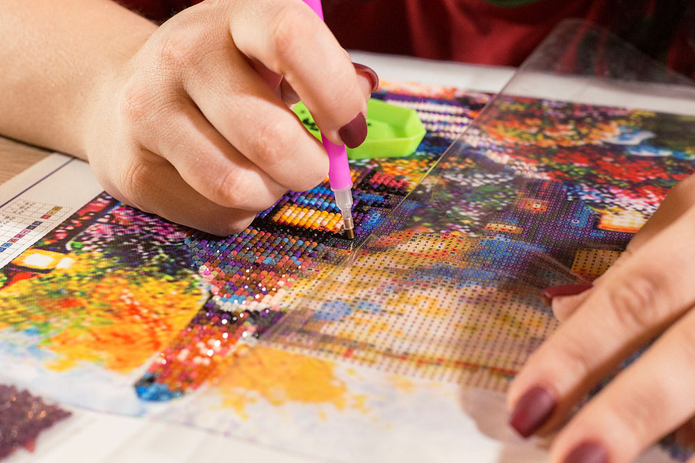 closeup working on diamond art painting