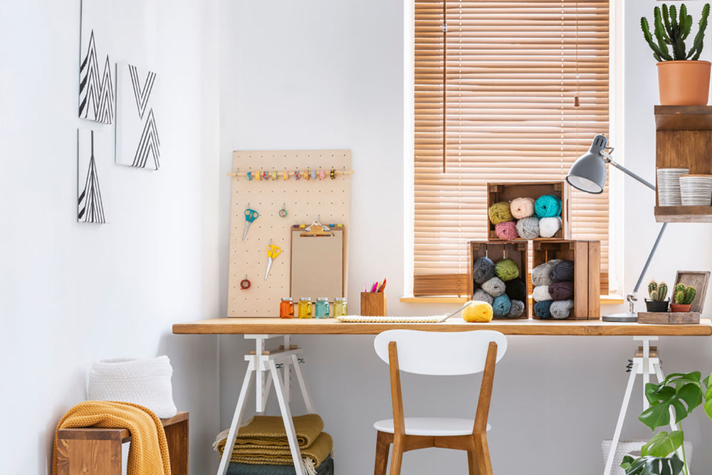 crafts room with desk and supplies