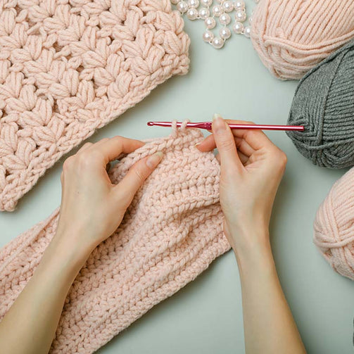 crochet hands threads pink grey