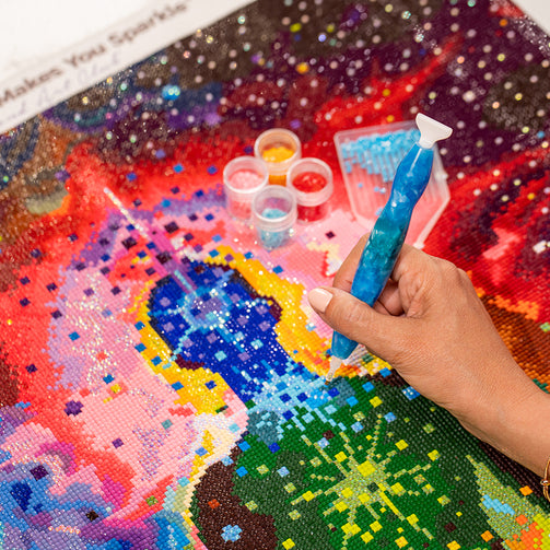 diamond painting with drill in hand