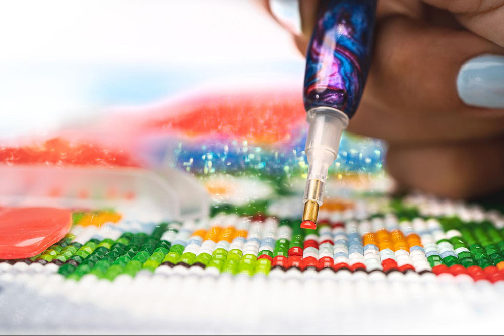a person doing a diamond painting
