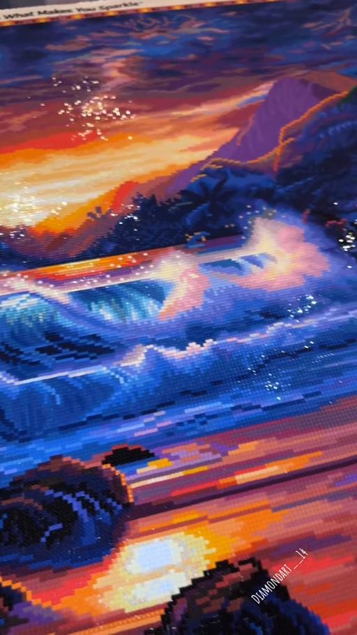 Sunset and sparkling blue ocean waves on the completed Eternal Embrace canvas