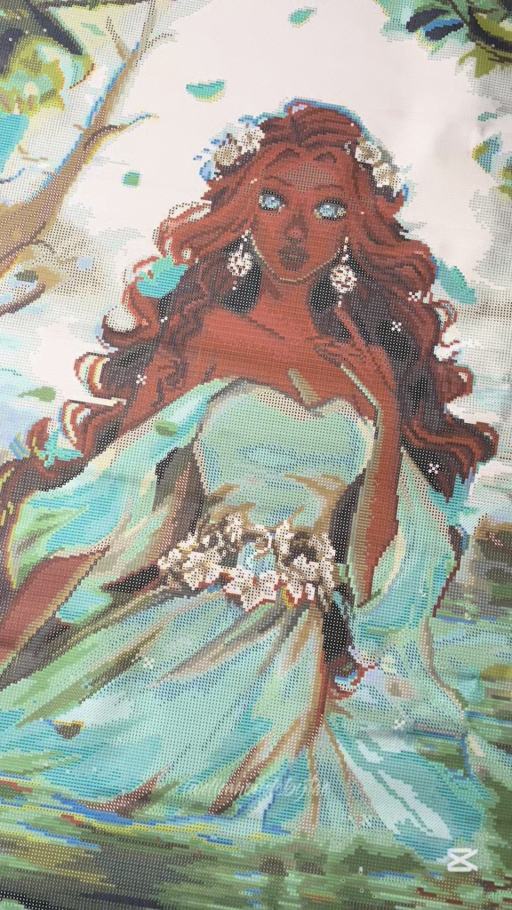 The Goddess of Water canvas freshly unrolled with flowing blue fabric and white flowers