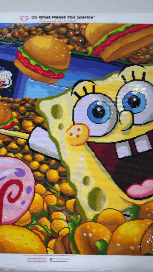 A completed Krabby Patties canvas sparkling with SpongeBob, Patrick, and Gary