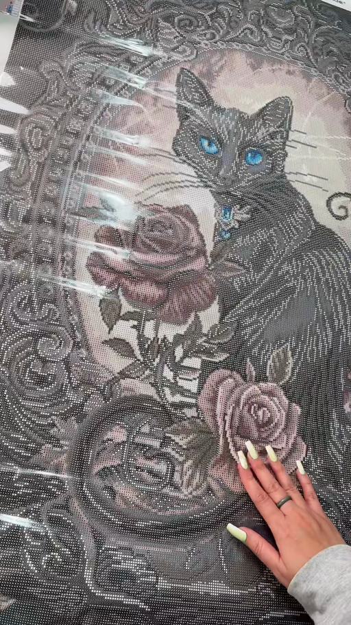 The blue-eyed black cat and roses on the Paracelsus Philosopher’s Familiar canvas