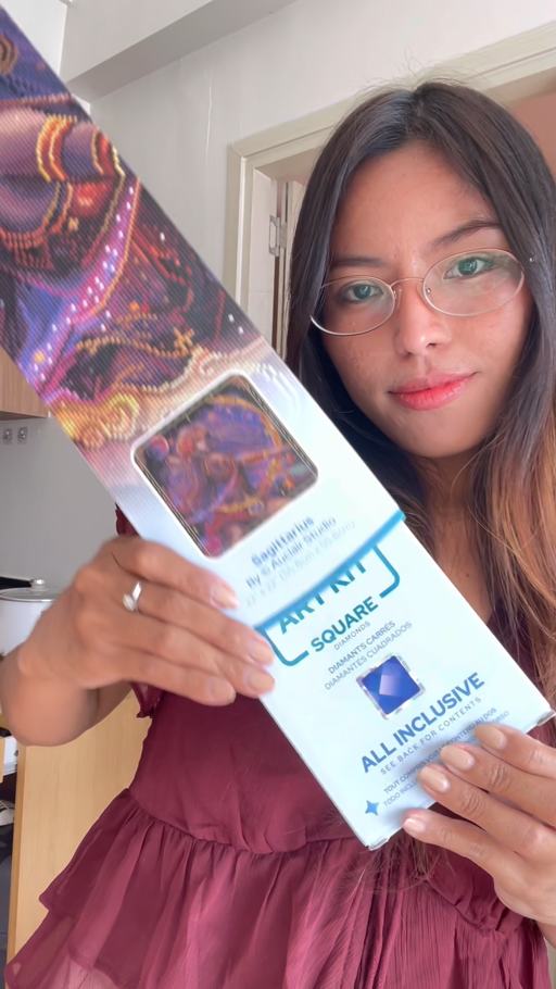 Creator madilucids holding her Sagittarius diamond painting kit
