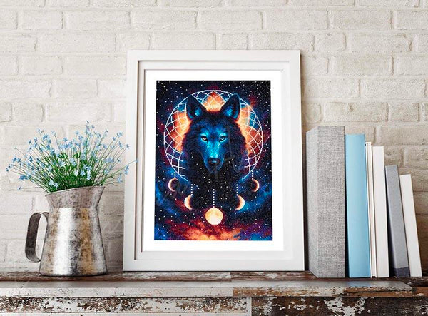 A finished diamond painting displayed in a white frame on a shelf.