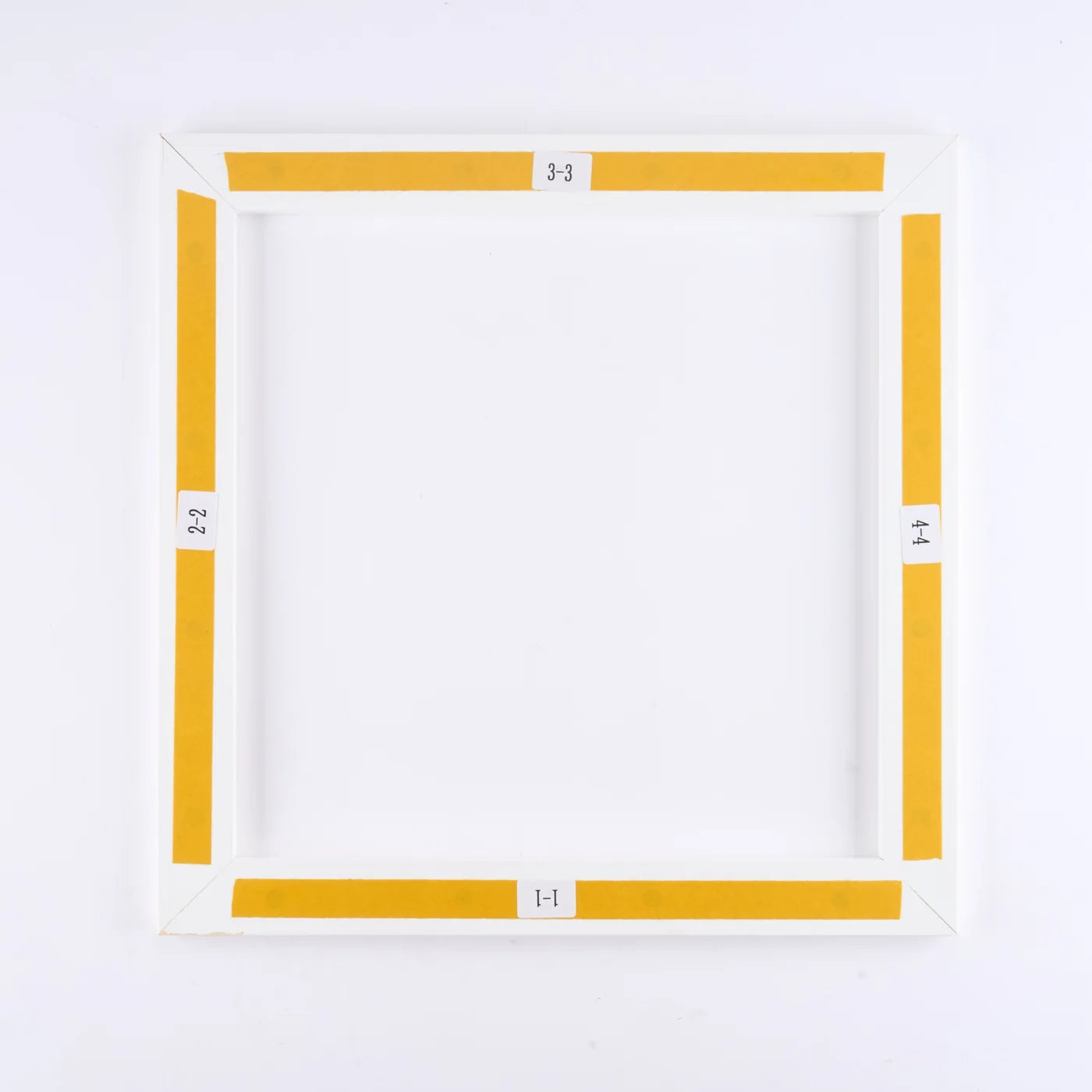 Assembled back frame with all four yellow adhesive liners still in place
