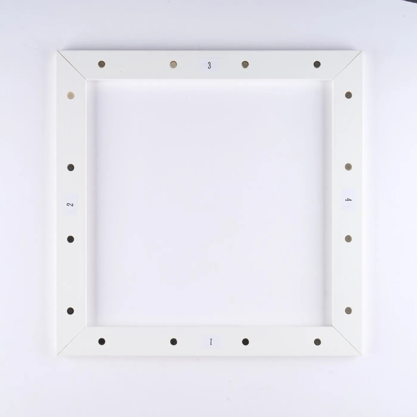 Underside of the assembled front frame showing the numbered sections and magnets that connect to the back frame